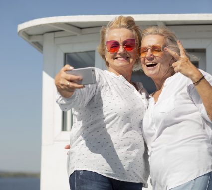 medium-shot-senior-women-taking-selfie